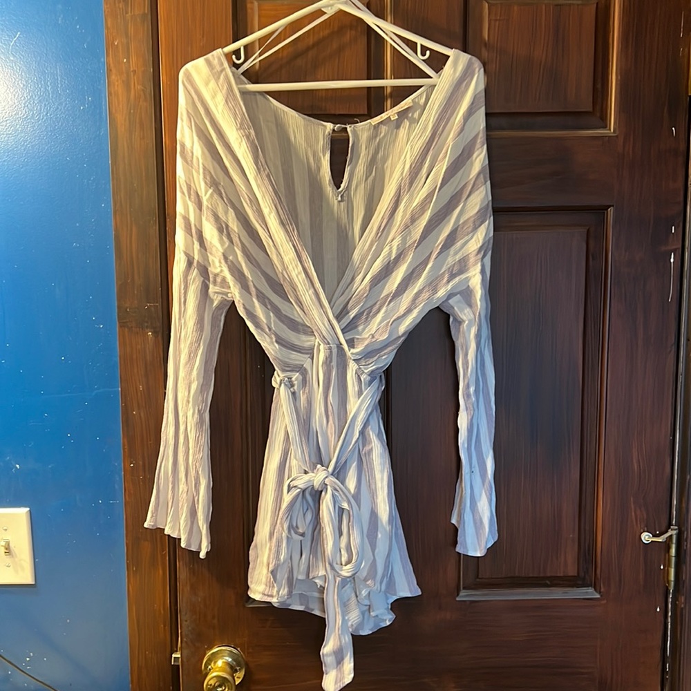 Worn once. Long sleeve romper from buckle.